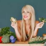 beautiful-girl-make-salad-sporty-blonde-kitchen-woman-with-avocado_1157-41856